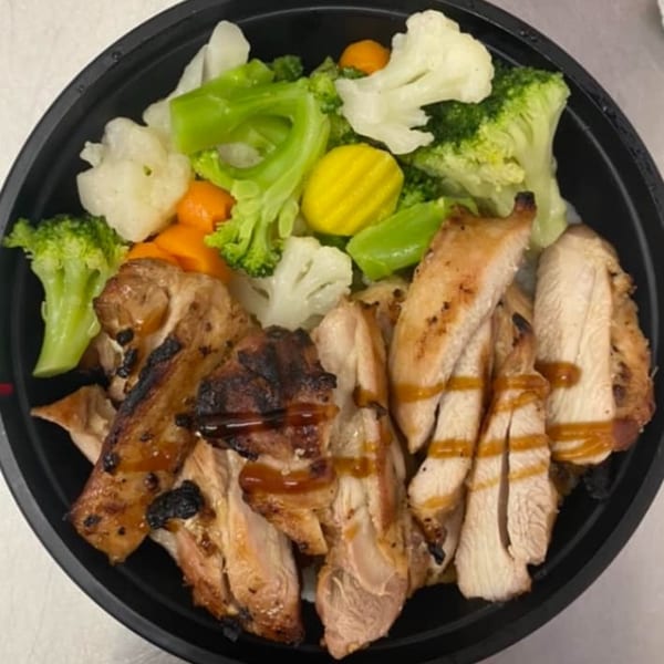 Maui Teriyaki and Sushi's chicken teriyaki bowl with broccoli, cauliflower, carrots, and yellow squash.