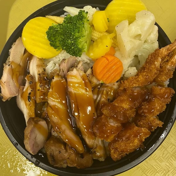 Maui Teriyaki and Sushi bowl with chicken, fried shrimp, rice, and mixed vegetables.
